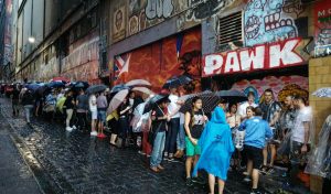 Outside in the allet way, around the corner from The Forum fans waiting. It has been raining all day and during the night, whilst waiting it only trickled rain on/off